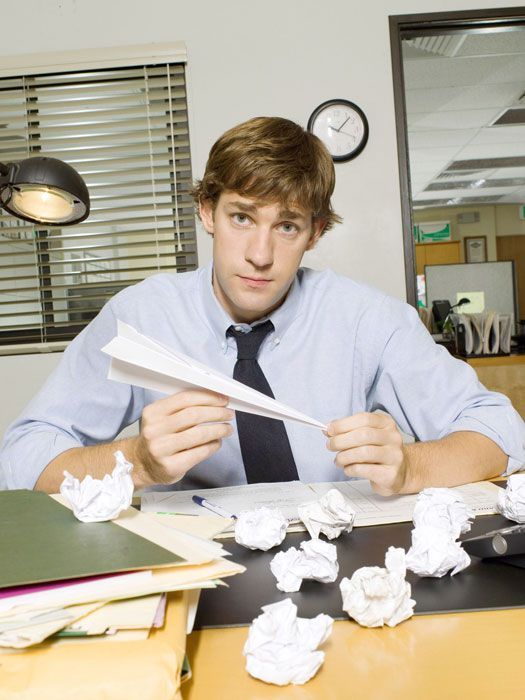 a man sitting at a desk with papers in front of him