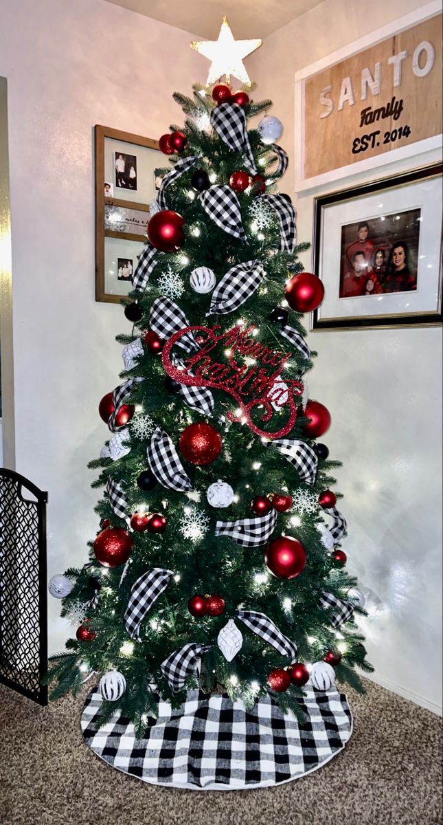 a christmas tree decorated with red, white and black ornaments