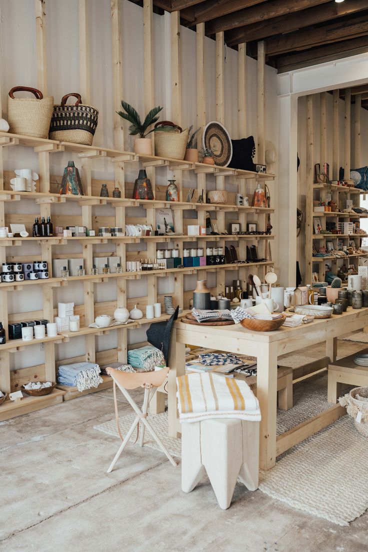 a room filled with lots of wooden shelves