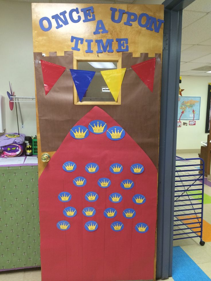 a door decorated to look like a barnyard with the words once upon time on it