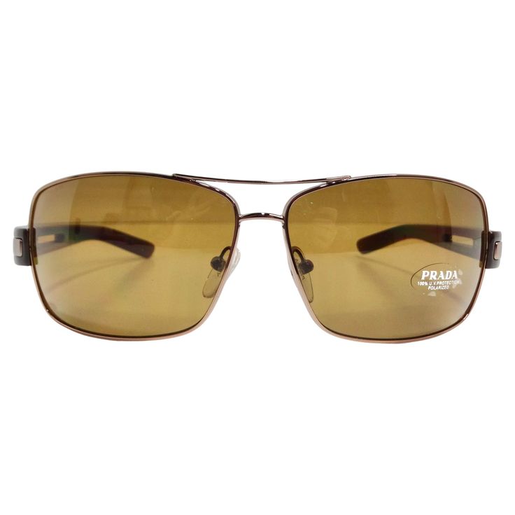 Elevate your eyewear game with the Prada 1990s Brown Aviator Sunglasses, a classic aviator style that exudes timeless chic and sophistication. These sunglasses feature thin gold-tone rims, paired with brown arms adorned with gold-tone Prada logos, creating a look that is both luxurious and versatile. The brown lenses add a touch of understated elegance, making these sunglasses a stylish accessory for any occasion. Being dead stock from a dealer in Manhattan, these sunglasses not only carry a sense of nostalgia but also offer an exclusive and rare addition to your collection. The aviator style, coupled with the gold-tone detailing, creates a look that is both retro-inspired and perpetually fashionable. Whether you're strolling through the city or enjoying a sunny day, the Prada 1990s Brown Brown Aviator Sunglasses, Dior Boots, Miu Miu Handbags, The Aviator, Timeless Chic, Prada Logo, Miuccia Prada, Aviator Style, Understated Elegance