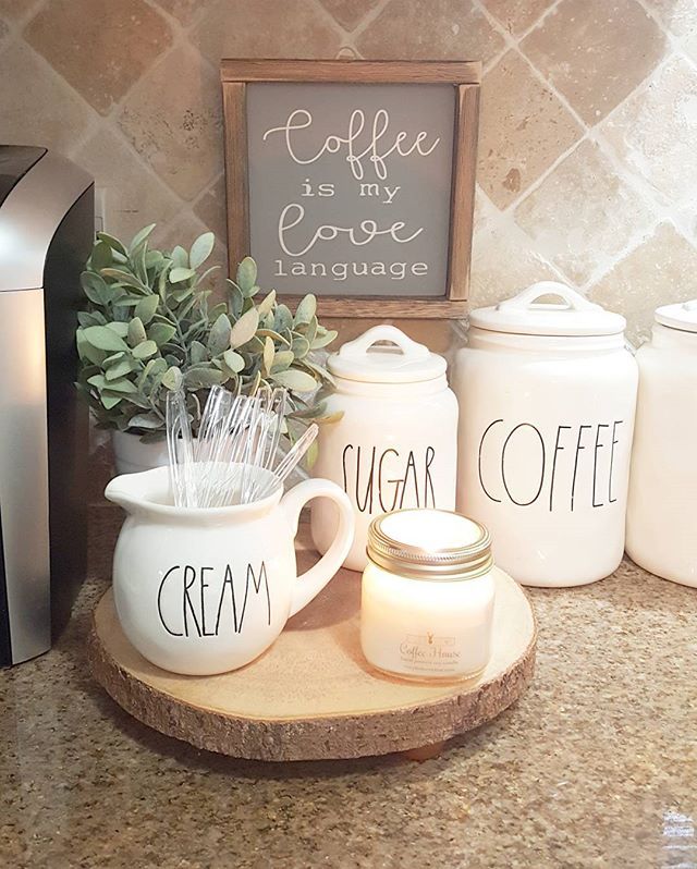 coffee mugs and sugar jars on a counter