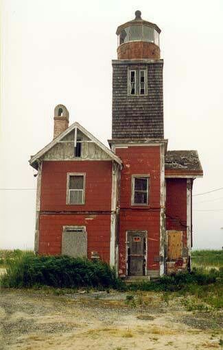 an old red building with a tower on top