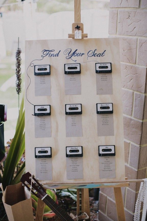 the table is set up for a wedding with plates and menus on it, along with an assortment of desserts