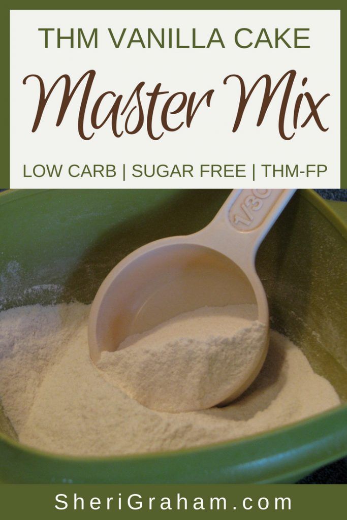 a green bowl filled with white sugar next to a wooden spoon and text overlay that reads, thm vanilla cake master mix low carb sugar free