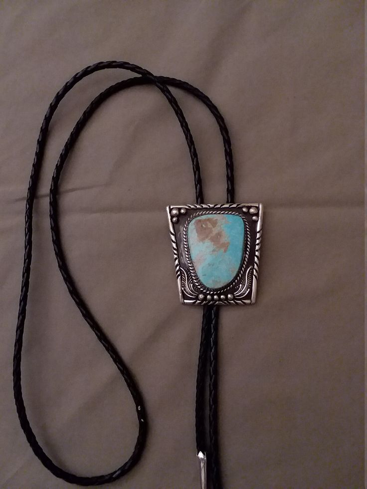 Sterling silver with turquoise bolo tie Blue Lariat Bolo Tie For Gift, Adjustable Turquoise Lariat Bolo Ties, Silver Bohemian Bolo Tie With Adjustable Cord, Southwestern Silver Jewelry With Adjustable Cord, Silver Bolo Ties As A Gift, Silver Lariat Bolo Tie With Adjustable Cord, Elegant Concho Bolo Tie, Elegant Adjustable Concho Bolo Ties, Adjustable Southwestern Bolo Tie For Formal Occasions