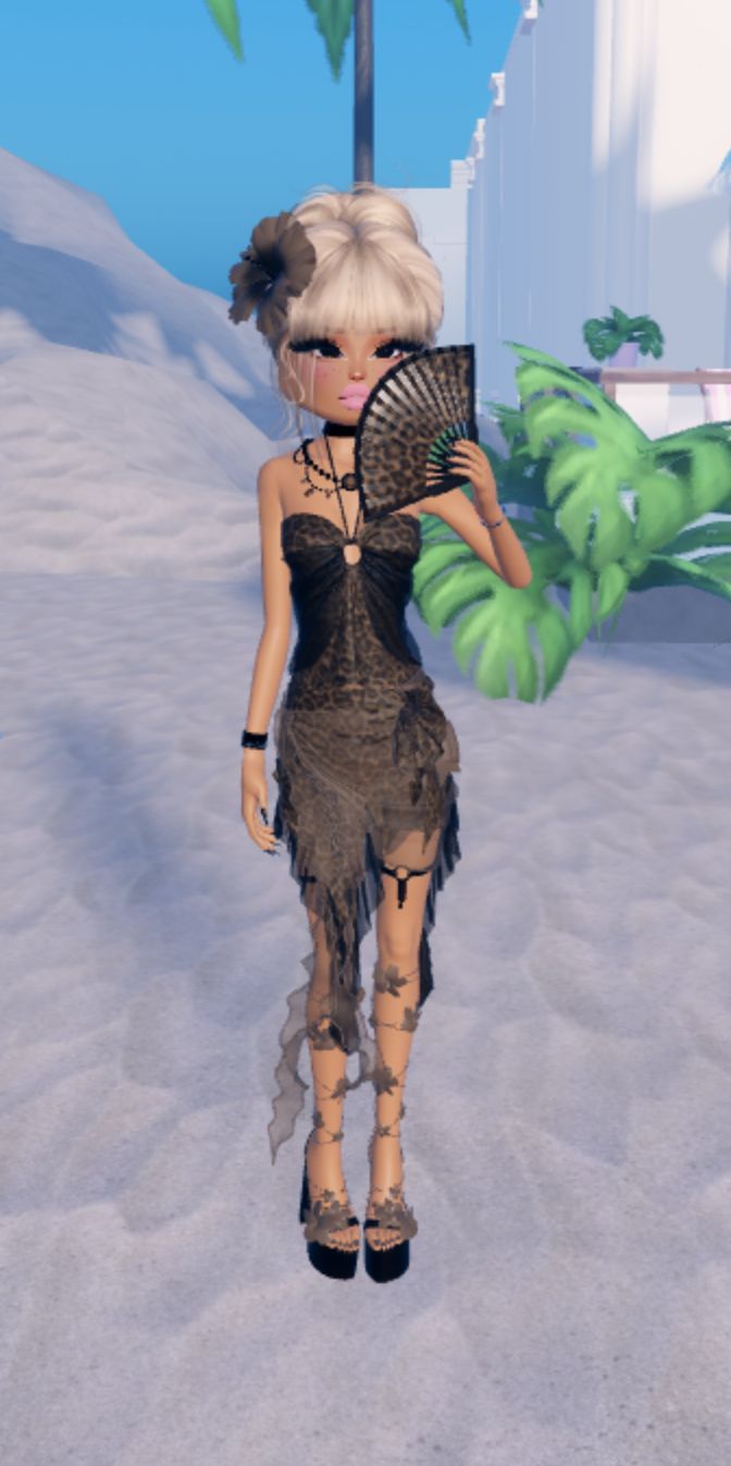 a woman is standing in the snow with a fan and palm trees around her neck