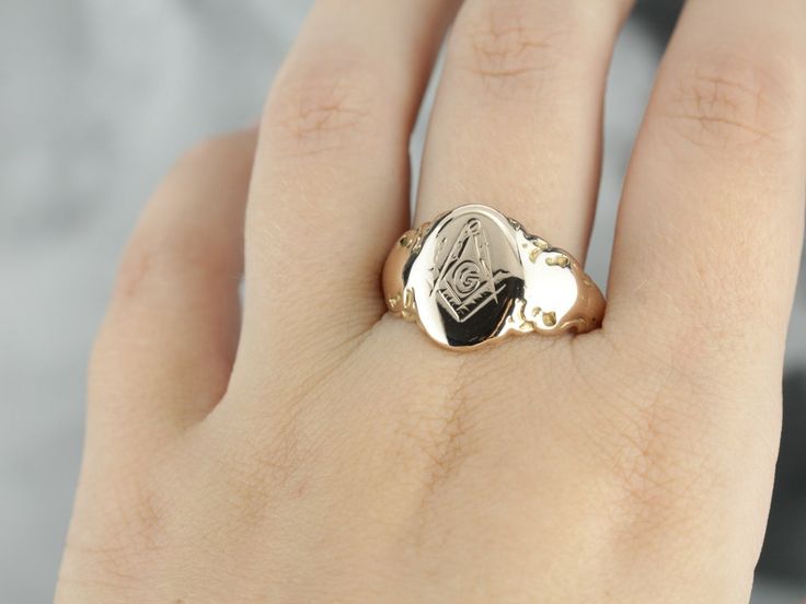 This men's ring features a classic Masonic emblem. Crafted in the Victorian era of traditional warm, rose gold, this handsome piece has an elegant silhouette and features excellent engraving at the center. Inside the band are the intricately engraved initials "E.S." Metal: 14K Antique Rose Gold Top Measurements: 10 x 14 mm, Oval Ring Size: 10 Marks: "ES" Engraved, "14K" Stamped on the inside band Rose Gold Top, Signet Ring Men, Engraved Initials, Gold Signet Ring, Oval Rings, Gold Top, Antique Roses, Men's Ring, Victorian Era