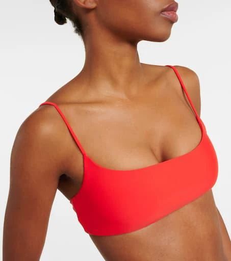 Material: 78% nylon, 22% elastane.Care instructions: hand wash.Made in the USA.Designer color name: Coral.True to size.Cup size: A/B.Minimal coverage.If you wear a C cup or bigger, we recommend trying one size larger.The model seen in the picture is 178cm-5'10', cup size B, and wearing a size XS Sporty Polyamide Swimwear For Swimming, Sporty Padded Swimwear For Workout, Sporty Stretch Swimwear In Polyamide, Sporty Nylon Swimwear With Padded Cups, Sporty Stretch Swimwear With Padded Cups, Stretch Beachwear Sports Bra, High Stretch Sports Bra For Swimming, Summer Workout Sports Bra With Padded Cups, Sporty Solid Swimwear With Padded Cups