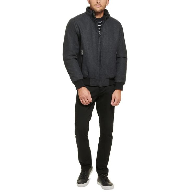 This wool bomber jacket with knit trim is a versatile coat that can be worn anywhere, from the boardroom to a night out on the town. It is a classic style that is sure to impress with its timeless look and sleek fabric. Heading to work or off the clock, keep warm while looking fashionably modern with this versatile bomber coat from Calvin Klein..Medium weight.Sits at waist.Regular fit.Stand collar; Zip-front closure.Single entry hand pockets with zipper closure.Inner channel quilt lining; Metal logo at back neck; Open cuffs with knit rib detail; Seam details at shoulder.Shell: Wool/polyester/nylon/acrylic/other fiber; Body lining: Nylon; Sleeve lining: Polyester.Dry clean only.Imported Classic Winter Varsity Jacket With Ribbed Cuffs, Winter Business Outerwear With Ribbed Cuffs, Classic Fitted Varsity Jacket For Winter, Modern Winter Outerwear With Ribbed Cuffs, Fitted Wool Outerwear With Ribbed Cuffs, Fitted Wool Varsity Jacket For Winter, Classic Fall Sport Coat With Ribbed Cuffs, Winter Wool Varsity Jacket With Ribbed Collar, Classic Wool Outerwear With Ribbed Collar