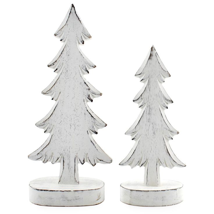 two white wooden christmas trees sitting on top of each other in front of a white background