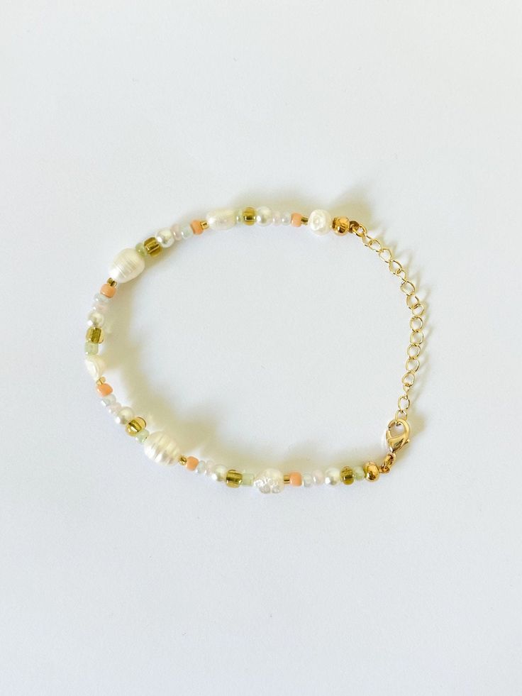 Beaded Bracelet  Hand beaded - real fresh water pearls & seed beads It is not recommended to wear bracelets or necklaces in water - swimming, showering etc.   Delicate - handle with care Adjustable in size! Adjustable Beaded Pearl Bracelet, Handmade Cream Pearl Bracelet With Round Beads, Pearl Beaded Bracelets With Pearl Charm For Beach, Beach Beaded Bracelets With Pearl Charm, Beaded Pearl Bracelet With Round Beads, Beaded Round Pearl Bracelet, Pearl Bracelet With Beaded Round Beads, Pearl Bracelet With Tiny Round Beads, Gold Pearl Bracelet With Round Beads For Beach