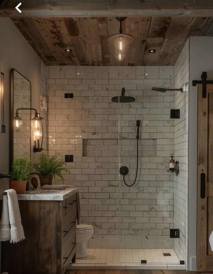 a bathroom with a shower, toilet and sink in the middle of it's room