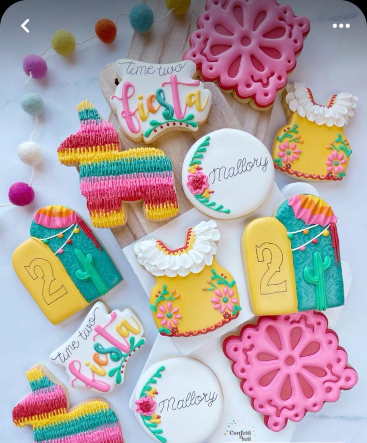 some decorated cookies are on a table