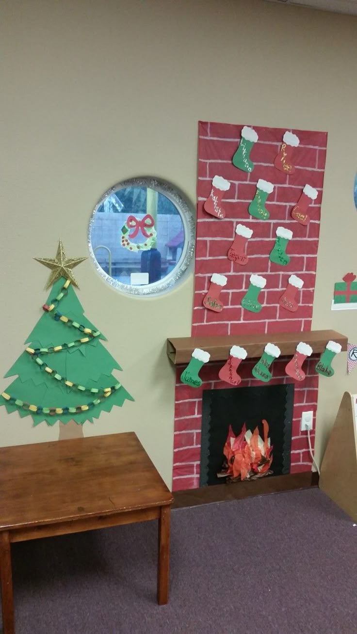 a living room decorated for christmas with decorations on the wall and fire place in the corner