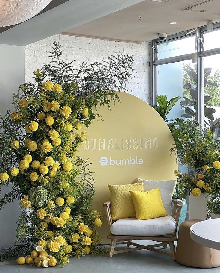 a room with yellow flowers and plants on the wall