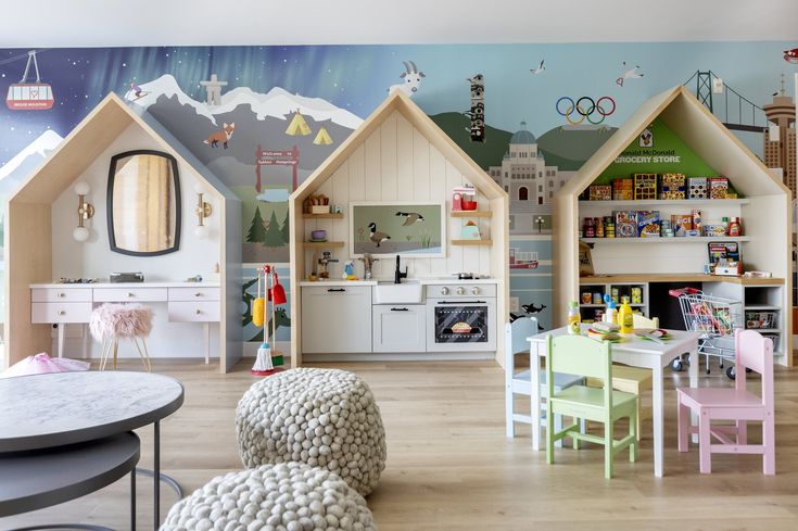 a child's playroom with toys, furniture and decor on the walls is decorated in pastel colors