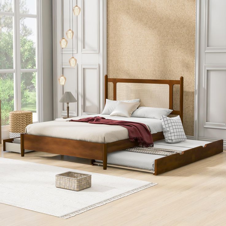 a bed sitting on top of a wooden frame in a bedroom next to a window