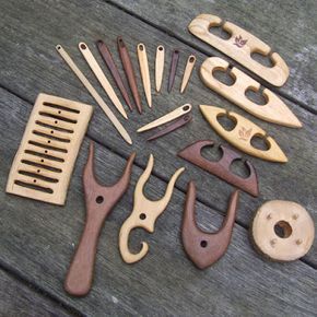 a collection of wooden tools sitting on top of a wooden table next to each other