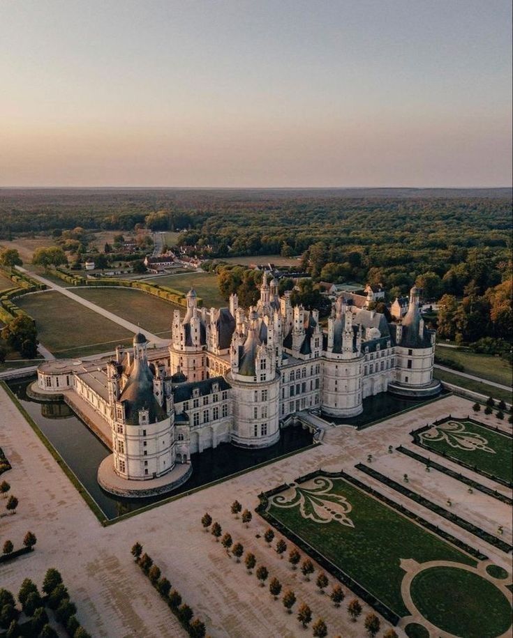 an aerial view of a large white castle