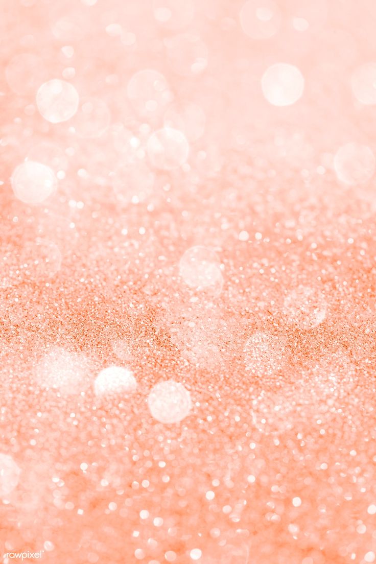 an orange and pink glitter background with small white dots on the left side of the image