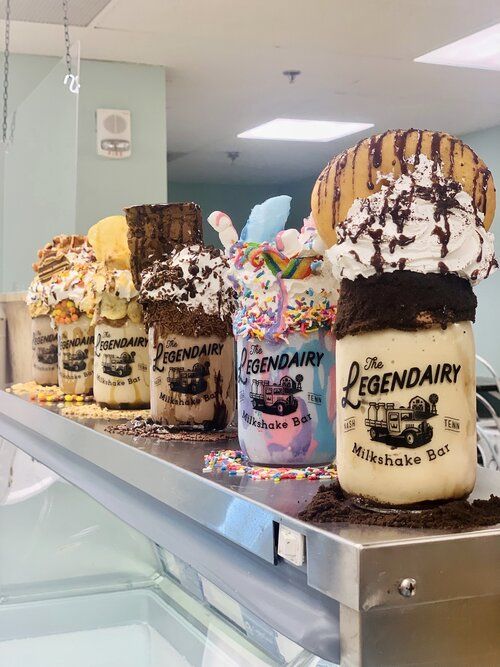 ice cream sundaes are on display in a store