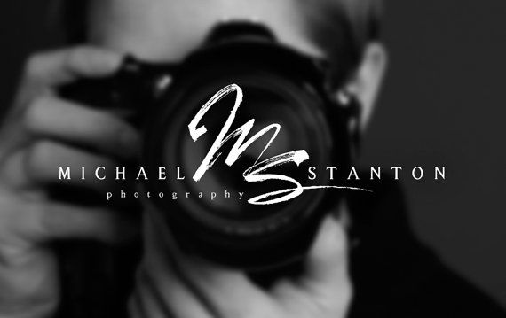 a man holding a camera up to his face with the words michael stanton written on it