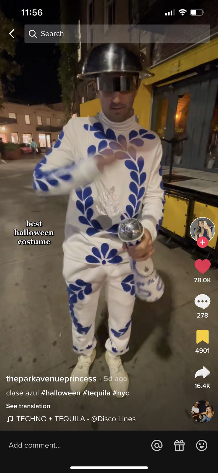 a man in a white and blue outfit is holding a silver object while wearing a helmet