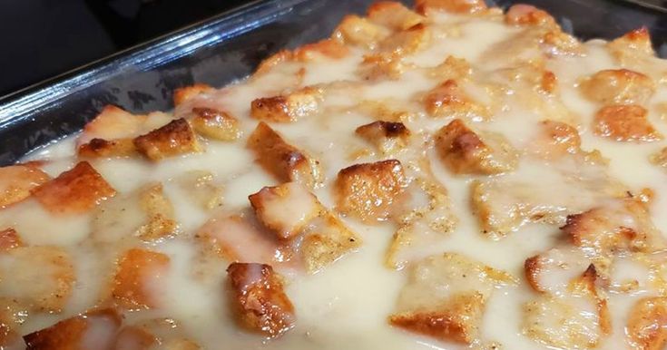 a casserole dish covered in cheese and meat