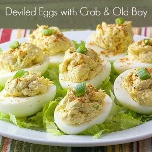 deviled eggs with crab and old bay mayonnaise on a bed of lettuce