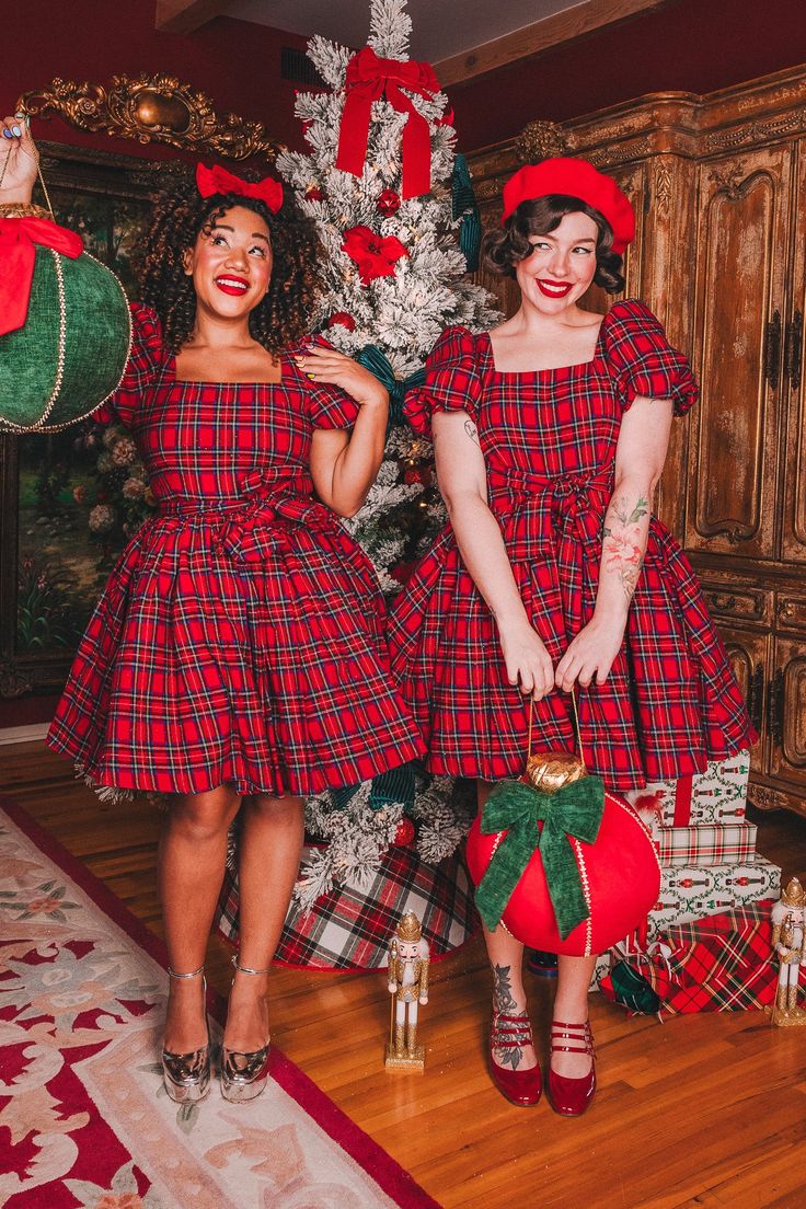 Ivy City x Courtney and KeikoTime to unwrap our long-awaited holiday collaboration with Courtney @colormecourtney and Keiko @keikolynn! Get ready to rock the holiday party with our Nutcracker Dress! Made of red cotton fabric with a fun multicolored plaid design, this women's dress features a square neckline and short p Christmas Characters Dress Up, Christmas Dress Pattern, Pink Tulle Fabric, Nutcracker Dress, Festive Christmas Outfit, Xmas Dress, Ivy City Co, Thanksgiving Dress, Trendy Christmas Outfits