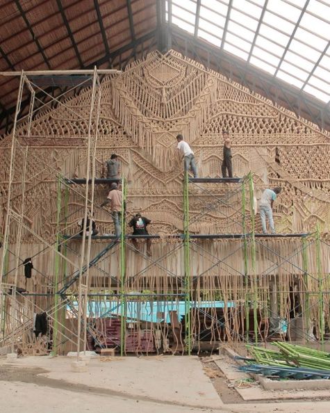 men working on scaffolding in a building under construction