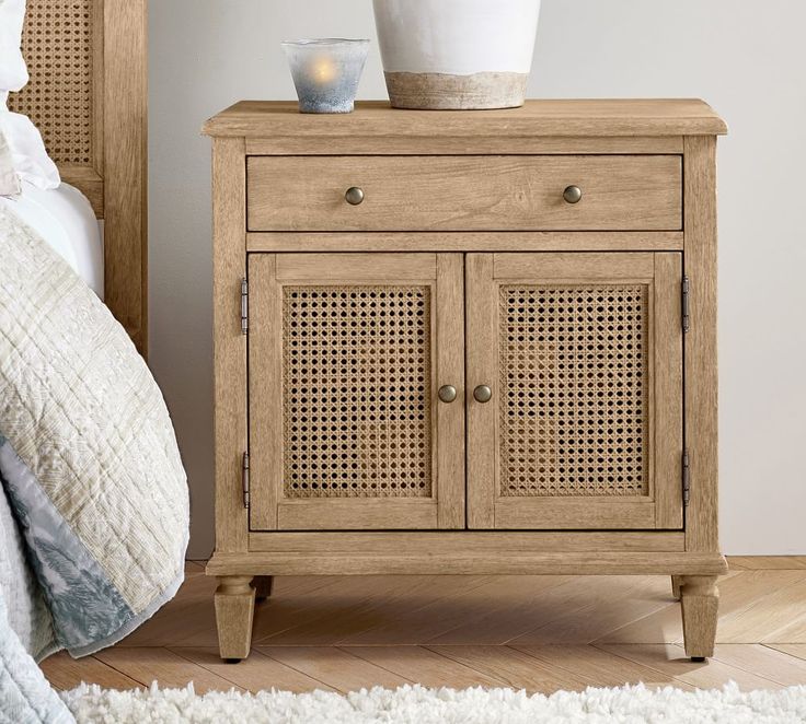 a wooden cabinet with two baskets on top of it