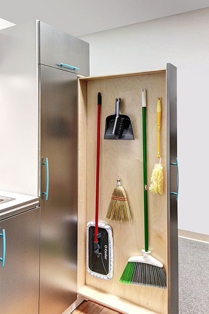 a stainless steel refrigerator freezer sitting inside of a kitchen