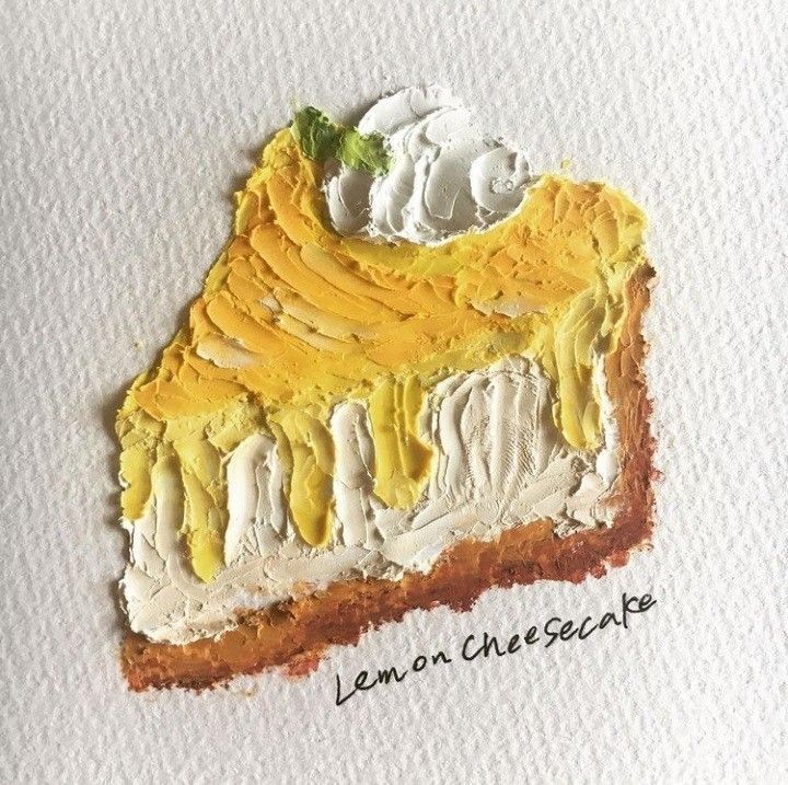 a piece of paper with yellow and white paint on it that says lemon cheesecake