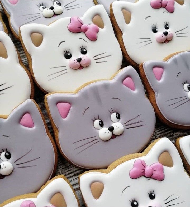 many decorated cookies with cats on them