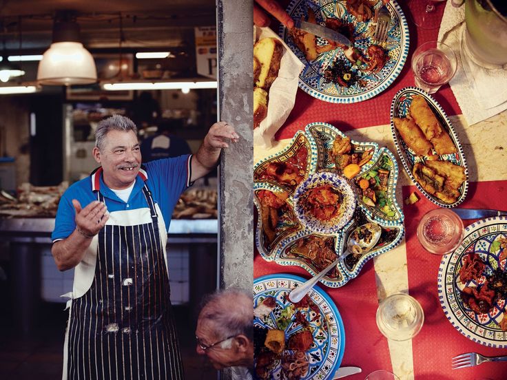 a man standing in front of a table full of food