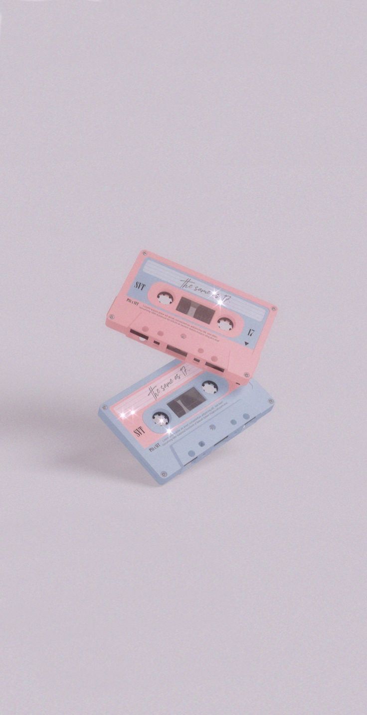 two pink cassettes sitting on top of each other