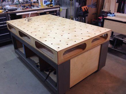 a workbench in a garage with tools and other items