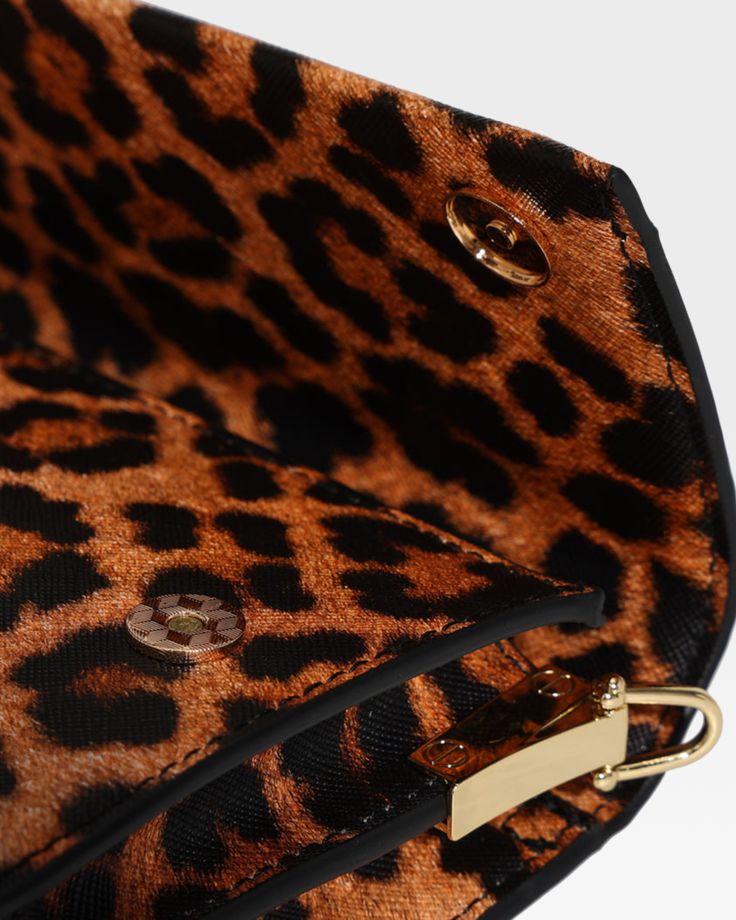 Unleash your wild side with this stunning Leopard Print Shoulder bag that perfectly blends fierce style with elegance. This bag features a bold leopard print design, crafted from high-quality materials that ensure durability and a luxurious feel. The standout gold-tone chain adds a touch of glamour, making this bag an ideal accessory for both day and night outings. Whether you're heading to a casual brunch or a chic evening event, this bag is your perfect companion, bringing a touch of exotic fl Leopard Print Shoulder Bag With Detachable Strap For Evening, Evening Shoulder Bag In Leopard Print With Detachable Strap, Leopard Print Leather Bag With Gold-tone Hardware, Evening Leopard Print Shoulder Bag With Detachable Strap, Everyday Leopard Print Bag With Chain Strap, Leopard Print Bag With Chain Strap For Everyday Use, Leopard Print Crossbody Bag With Detachable Strap, Chic Leopard Print Party Bag, Chic Leopard Print Party Bags