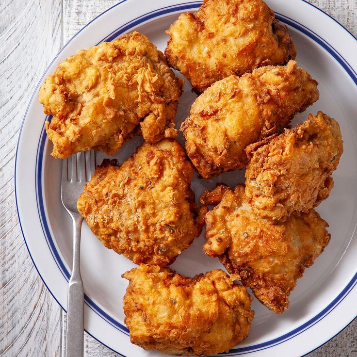 fried chicken on a plate with a fork