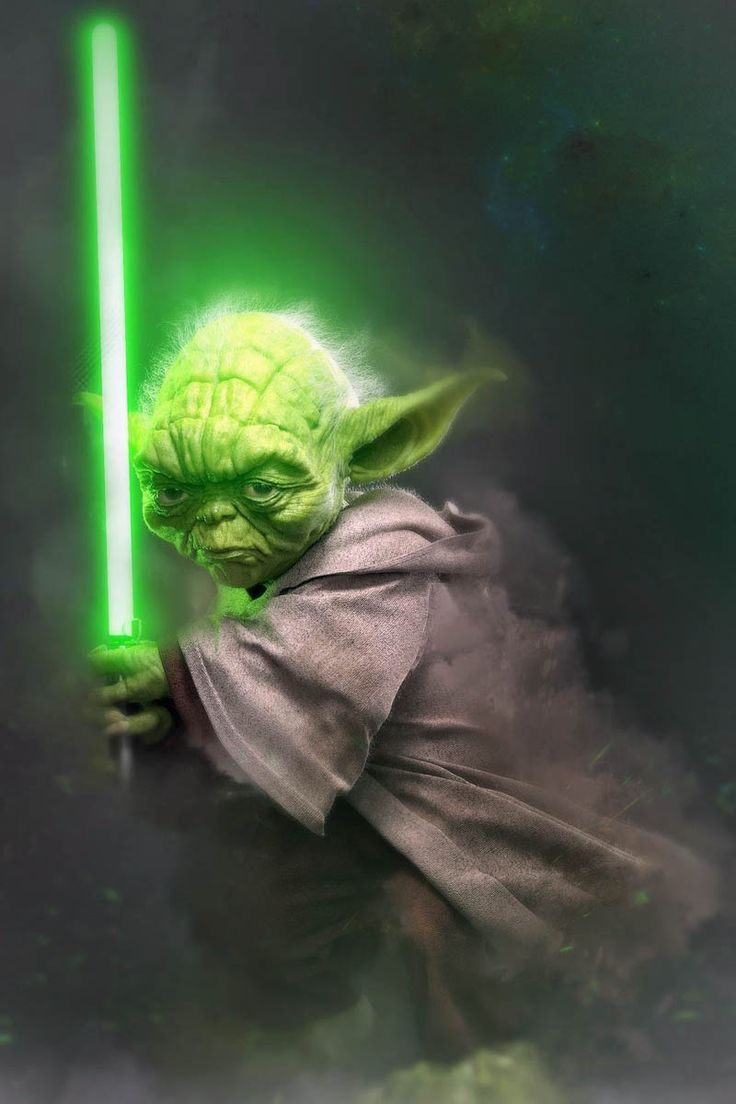 an image of yoda holding a green light saber