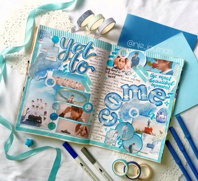 an open scrapbook with some scissors and other items