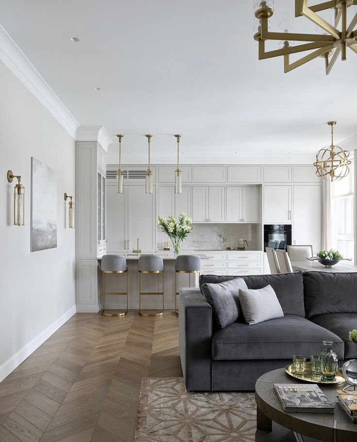 a living room filled with furniture and a chandelier