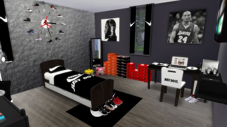 a bedroom decorated in black, white and red with pictures on the wall above the bed