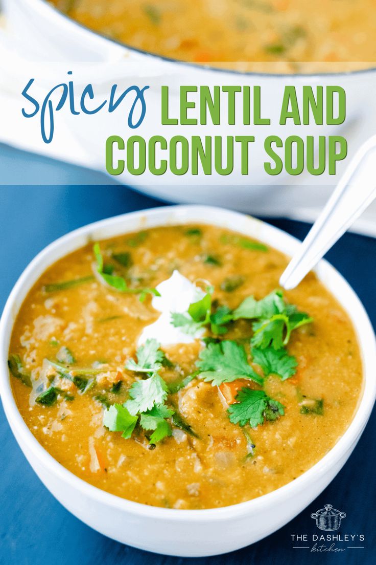 lentil and coconut soup in a white bowl on a blue table with a spoon