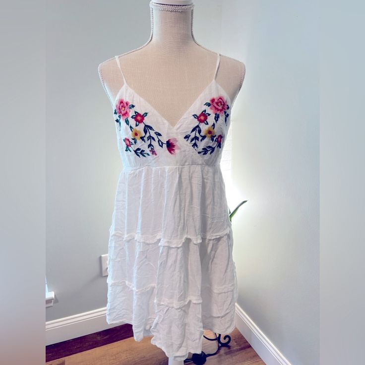 Summer Dress By Francesca Sz L White Linen With Embroidered Flowers. Never Worn Sleeveless Floral Embroidery Mini Dress For Daywear, Sleeveless Mini Dress With Floral Embroidery For Daywear, Summer Embroidered Mini Dress For Garden Party, Embroidered Mini Dress For Summer Garden Party, Embroidered Midi Mini Dress For Summer, White Embroidered Dress For Day Out, White Embroidered Mini Dress For Spring, Summer Embroidered Dresses For Day Out, Embroidered Summer Dress For Day Out