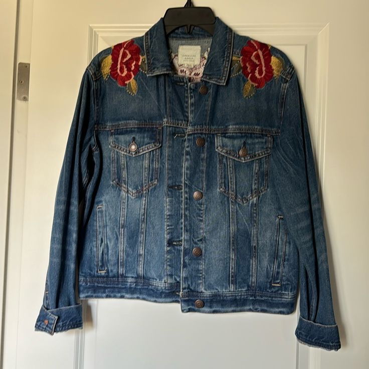 American Eagle Embroidered Denim Jacket With Red Floral Details Small New With Tags Approximate Measurements 21” Pit To Pit Across The Back 21” Length Don’t Have A Poshmark Account? Use Code Ashleystaks At Sign Up To Save $10 Off Your First Order Blue Embroidered Relaxed Fit Outerwear, Blue Embroidered Outerwear With Relaxed Fit, Embroidered Relaxed Fit Outerwear For Fall, Casual Embroidered Denim Blue Outerwear, Casual Embroidered Denim Outerwear, Denim Outerwear With Multicolor Embroidery Long Sleeve, Embroidered Denim Blue Outerwear For Fall, Denim Outerwear With Multicolor Embroidery And Long Sleeve, Casual Denim Jacket With Multicolor Embroidery