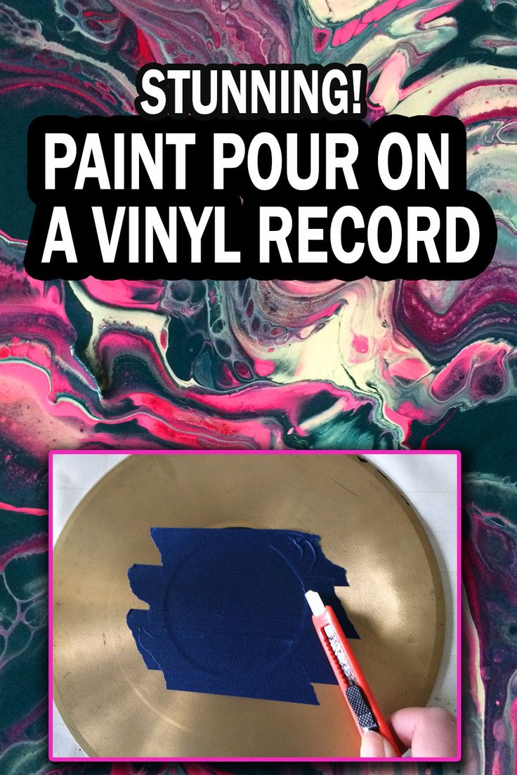 someone is painting on a gold plate with blue and pink swirls in the background