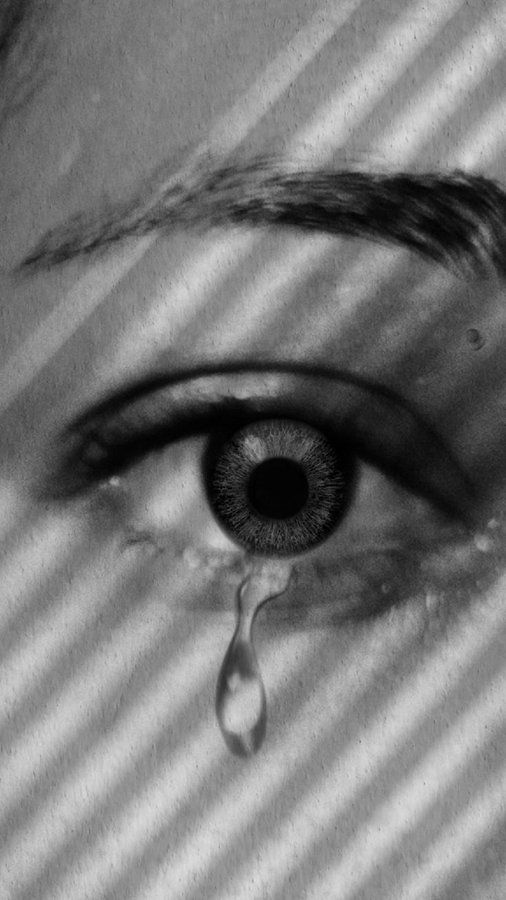 a woman's eye with water dripping from it